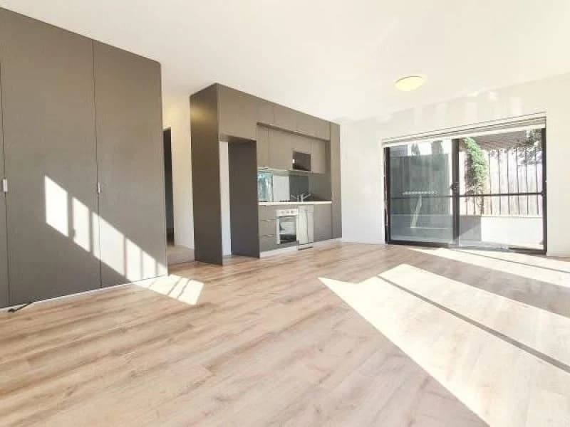 Empty rental apartment photographed on a phone before virtual staging